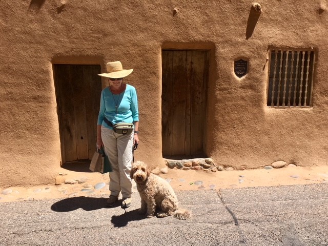 SBMA Traveler Jan Everote in front of the oldest building in Santa Fe